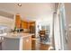 Kitchen area features stainless appliances, breakfast bar and overlooks spacious eating area at 9703 Ogden Ct, Thornton, CO 80229