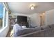 Cozy living room with a large couch, media center, and plenty of natural light at 9703 Ogden Ct, Thornton, CO 80229