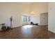 Bright living room with soaring ceilings, tiled floors, and abundant natural light from bay windows at 9703 Ogden Ct, Thornton, CO 80229