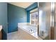 Main bathroom showcasing a soaking tub with jets, a shower, and a bright window at 9703 Ogden Ct, Thornton, CO 80229