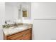 Small bathroom with granite vanity and mirrored medicine cabinet at 7861 W 90Th Dr, Broomfield, CO 80021