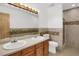 Bathroom boasts double sinks, shower, and tile flooring at 7861 W 90Th Dr, Broomfield, CO 80021