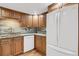 Updated kitchen with granite countertops and wood cabinets at 7861 W 90Th Dr, Broomfield, CO 80021