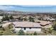 Wide aerial view of a beautiful home showing the neighborhood, mountains and landscaping at 11194 W Yucca, Littleton, CO 80125