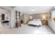 Cozy basement bedroom offers a reading nook, ladder shelves, and an en suite bathroom at 11194 W Yucca, Littleton, CO 80125
