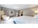 Cozy bedroom boasts a reading nook, carpeted floors, and access to an en suite bathroom at 11194 W Yucca, Littleton, CO 80125
