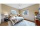 Cozy bedroom with a stylish rug, large windows providing natural light, and elegant decor at 11194 W Yucca, Littleton, CO 80125