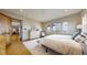 Spacious bedroom with natural light, hardwood floors, and cozy furnishings with a beautiful view at 11194 W Yucca, Littleton, CO 80125