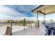 Spacious covered deck with a grill and seating offering scenic views of the surrounding landscape at 11194 W Yucca, Littleton, CO 80125
