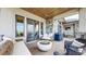Outdoor covered deck with a built-in grill, a fire pit, comfortable seating, and scenic views at 11194 W Yucca, Littleton, CO 80125