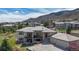 A beautifully landscaped house, highlighted by a driveway, trees, and stone design at 11194 W Yucca, Littleton, CO 80125