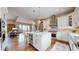 Open-concept kitchen with stainless steel appliances, custom cabinets, and a large island at 11194 W Yucca, Littleton, CO 80125