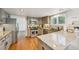 Bright kitchen with stainless steel appliances, granite countertops, and hardwood floors at 10068 Granite Hill Dr, Parker, CO 80134