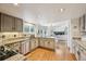 Open concept kitchen with hardwood floors, stainless steel appliances, granite countertops, and recessed lighting at 10068 Granite Hill Dr, Parker, CO 80134