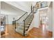 Carpeted staircase with iron railing that leads to the second story of the home at 10068 Granite Hill Dr, Parker, CO 80134