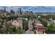 Aerial view featuring the Denver skyline with a church and residential homes at 1021 E 23Rd Ave, Denver, CO 80205