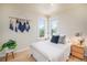 Cozy bedroom with lots of natural light, laminate flooring and soft furnishings at 1021 E 23Rd Ave, Denver, CO 80205