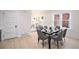 Modern dining room featuring a table, hardwood floors and views to the living room at 1021 E 23Rd Ave, Denver, CO 80205