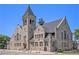 Historic stone building with a prominent tower and classic architectural details at 1021 E 23Rd Ave, Denver, CO 80205