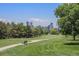 Scenic view of a well-maintained golf course with the city skyline in the distance at 1021 E 23Rd Ave, Denver, CO 80205