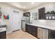 Well-lit kitchen features modern appliances, white backsplash, and sleek countertops at 1021 E 23Rd Ave, Denver, CO 80205