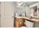 Updated bathroom featuring a sleek vanity, toilet, modern fixtures, and updated lighting at 1150 Vine St # 1006, Denver, CO 80206