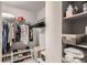 Walk-in closet featuring ample hanging space, shelves, and storage baskets at 1150 Vine St # 1006, Denver, CO 80206
