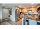 Modern kitchen featuring stainless steel appliances and granite countertops, adjacent to a bathroom at 1150 Vine St # 1006, Denver, CO 80206