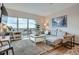 Cozy living room with a comfortable gray sectional couch, a balcony, and a stylish coffee table at 1150 Vine St # 1006, Denver, CO 80206