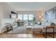 Bright living room featuring modern furnishings, a large balcony, and stylish decor at 1150 Vine St # 1006, Denver, CO 80206