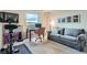 Cozy living room featuring a desk, comfortable sofa, artwork, and large window at 1150 Vine St # 1006, Denver, CO 80206