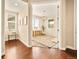 View of bonus room with neutral walls and carpet, natural light, and storage, as seen from a hardwood hallway at 7895 Julsburg Cir, Littleton, CO 80125