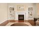 Living room fireplace features built-in shelving and decorative accents around the mantel at 7895 Julsburg Cir, Littleton, CO 80125