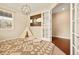 A versatile home office features a unique rug, teepee, Colorado flag, and ample natural light at 7895 Julsburg Cir, Littleton, CO 80125