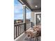 Relaxing patio with wicker furniture, offering stunning neighborhood views, perfect for outdoor enjoyment at 7895 Julsburg Cir, Littleton, CO 80125