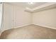 A carpeted room with a door and recessed lighting at 7895 Julsburg Cir, Littleton, CO 80125