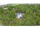 Aerial view of a home surrounded by dense forest, creating a private setting at 17420 Caribou Dr, Monument, CO 80132
