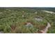 Aerial view of the home with boundary lines, showing privacy within a forested area at 17420 Caribou Dr, Monument, CO 80132