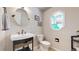 Charming powder room with unique vanity, mirror, and stylish decor at 17420 Caribou Dr, Monument, CO 80132