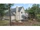 Back exterior view of a two-story home with a large deck and landscaped backyard at 17420 Caribou Dr, Monument, CO 80132