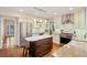 Well-appointed kitchen with stainless steel appliances, center island, white cabinetry, and hardwood floors at 17420 Caribou Dr, Monument, CO 80132