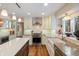 Beautiful kitchen featuring a large island, modern appliances, and an open layout connecting to dining area at 17420 Caribou Dr, Monument, CO 80132