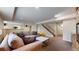 Spacious living room with plush seating, stairs and neutral tones creating a cozy and inviting atmosphere at 17420 Caribou Dr, Monument, CO 80132