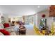 Spacious living room offers views, ample seating, an entertainment center, and backyard patio access at 17420 Caribou Dr, Monument, CO 80132
