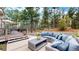Inviting outdoor patio with a comfortable seating area and lush wooded surroundings at 17420 Caribou Dr, Monument, CO 80132
