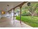 Covered backyard patio offers a relaxing outdoor living space with a lush, green lawn at 502 Nile St, Aurora, CO 80010
