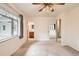 Bedroom featuring neutral walls, carpet floors, ceiling fan, and two closets at 502 Nile St, Aurora, CO 80010