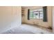 Bedroom with carpet floors, neutral paint, and large window with exterior view at 502 Nile St, Aurora, CO 80010