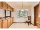 Bright dining area with a window and wooden chair at 502 Nile St, Aurora, CO 80010