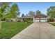 Ranch-style home featuring a two-car garage and spacious driveway at 502 Nile St, Aurora, CO 80010